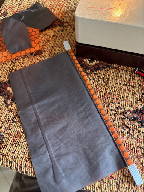 The pocket panel with embedded elastic lip.